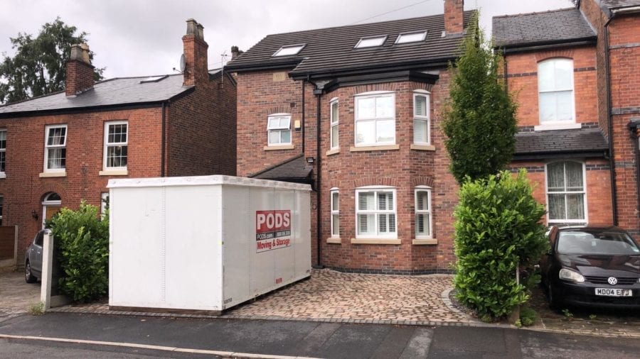 Container on nice Driveway PODS Moving and Storage